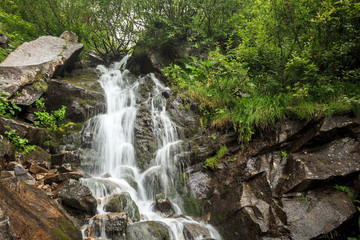 Fototapeta na wymiar waterfall in mountains Ukrainian Carphatian