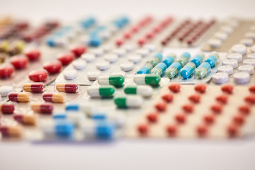 Many colorful medicines in blister packaging