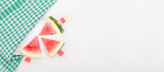 Three slices of watermelon on a white background. Triangle cut chopped watermelon slice