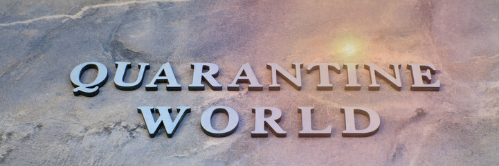 world quarantine , writen wooden letters on stone background