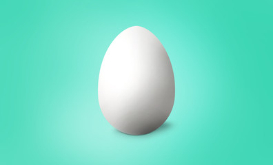 White Easter egg on turquoise pastel background. Happy Easter concept. 