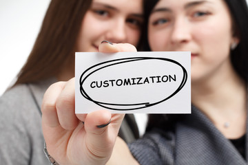 Business, technology, internet and network concept. Young businessman shows a keyword: Customization