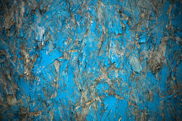 Background Made of Weathered Blue Presswood with a Dark Vignette