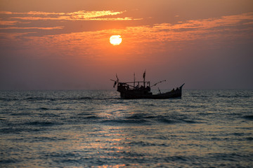 A fishing boat heads back to port in Cox's Bazar, Bangladesh
