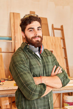 Young man as a proud carpenter
