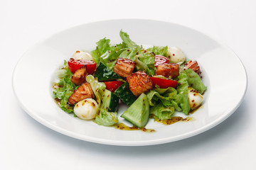 salad with egg on a plate on a white background