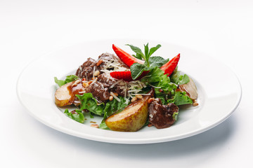 salad of pears, strawberries and greens on a white background