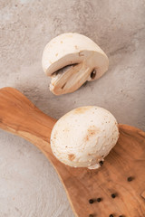 champignons in a cut on a gray background