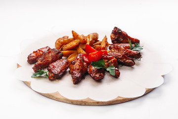 chicken wings with potatoes on a tree