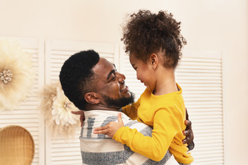 African american dad and daughter have fun and hugs