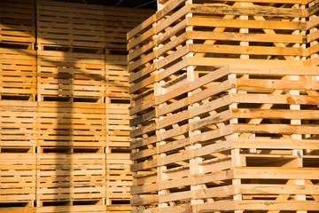 Folded empty wooden boxes in warehouses
