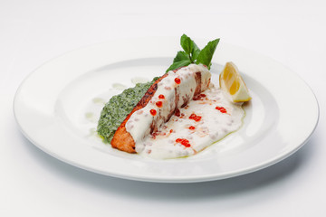 fish in white and green sauce
