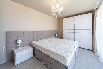 New luxury modern bedroom. New home. Interior photography.