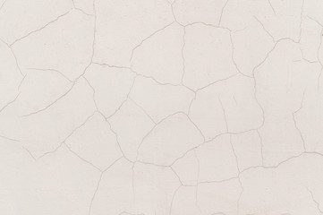 Old cracked wall with peeling stucco