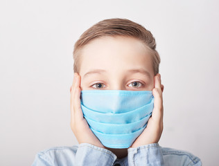 Child in medical mask. Coronavirus and Air pollution pm2.5 concept. Virus symptoms. Concept of epidemic, influenza, protection from disease, vaccination. Flu illness. Medical care. Insurance.