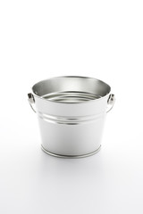 Bucket in front of a white background.