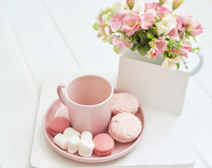 Mother's Day Greeting Card. Romantic breakfast. Happy mothers day frame background. Tea set with flowers and sweet. Spring card template. Happy Birthday or Valentine. Women's Day. Copy space.