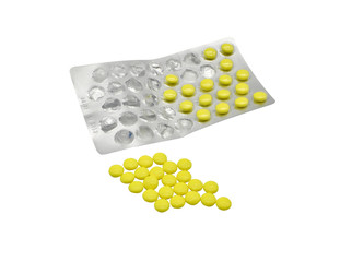 Gelbe Pillen und Vitamine mit Verpackung