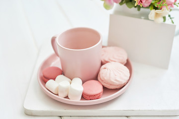 Mother's Day Greeting Card. Romantic breakfast. Happy mothers day frame background. Tea set with flowers and sweet. Spring card template. Happy Birthday or Valentine. Women's Day. Copy space.