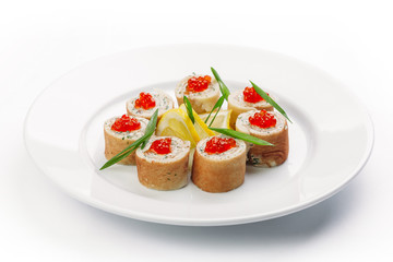 stuffed pancakes with caviar and lemon slices on a white background