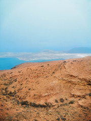 yellow mountain with sea