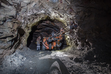 Underground gold mine tunnel with drilling machine