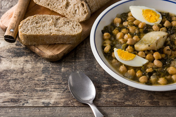 Chickpea stew with spinach and cod or potaje de vigilia. Typical spanish food for Easter holidays.	