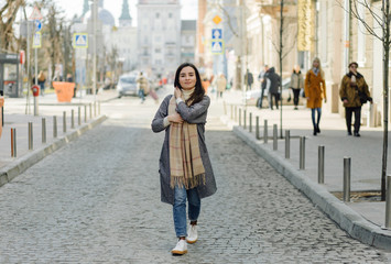 Fototapeta premium Woman portrait walking in the street