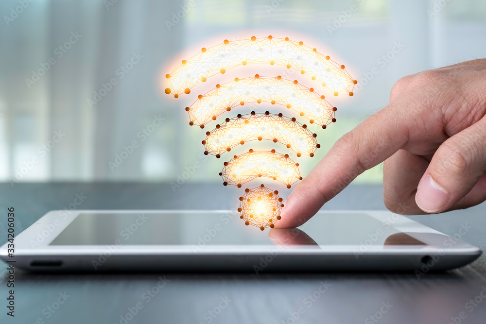 Poster hand pointing to tablet with wifi signal . technology concept.