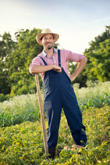 Sexy farmer with shovel.