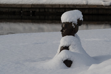 statue covered in snow