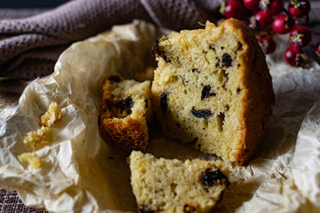 A large piece of homemade pie with prunes filling. orange and Apple, cut on parchment paper. Porous...