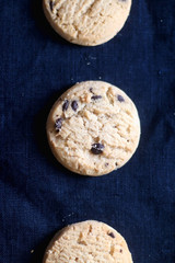 Chocolate chip cookies on dark blue background. Top view.