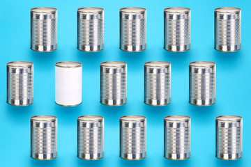 Blank tin cans in a diagonal pattern on a blue colorful background