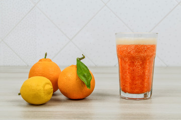 Fresh orange juice smoothie made from citrus fruits lemons and oranges
