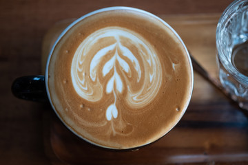 Hot coffee latte art in cup. hot drink coffee with milk froth for breakfast.