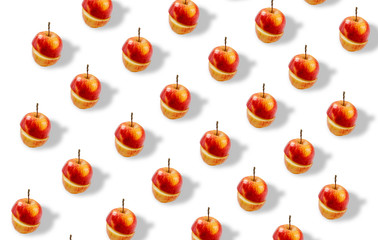 Trendy repeating pattern. Juicy red apples on a white background. Minimum summer concept. A banner from the same cut apples.