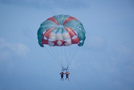 Beautiful shot of Parasailers in the Gulf of Mexico with a blue sky in the background