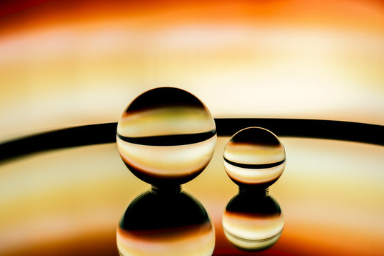 Abstract image of glass spheres under neon lights