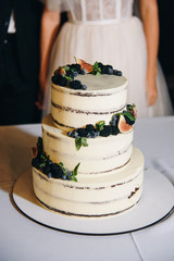 wedding cake with berries and flowers