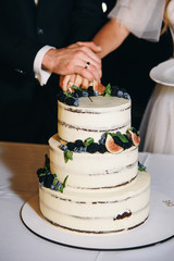 wedding cake with berries and flowers