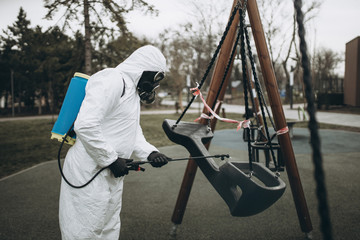 Cleaning and Disinfection on the playground in the sity complex amid the coronavirus epidemic Teams...