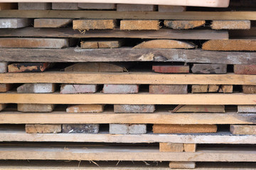 short clipped boards lie in pallets. They've been cut recently.Background