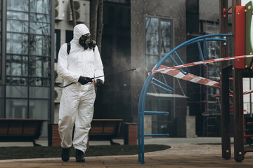 Cleaning and Disinfection on the playground in the sity complex amid the coronavirus epidemic Teams...