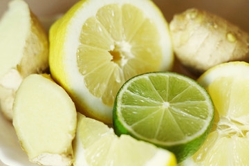 A close up of lemons, lime and ginger