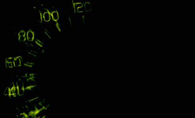 Driver's cockpit ; speedometer on dashboard - colorful light in black, copy space for your design
