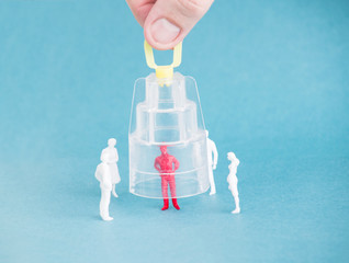 A protective cap is put on a sick person. The concept of quarantine and self-isolation against the spread of coronavirus infection. Infection of friend from people, isolation, COVID19