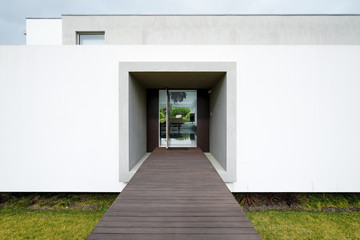 Modern house entrance with open door and access.