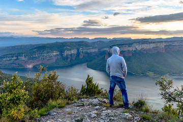 Hiker enjoy a beautiful view over the lake.