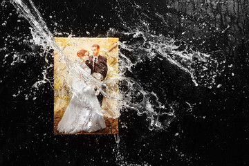 Canvas print, clear water splash, drops on black background, front view. Stretched wedding photo, wall decor. Photo with protective coating, waterproof ink. Water pouring canvas